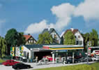 Petrol station with service bay
