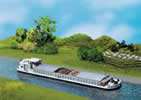 River cargo boat with dwelling cabin